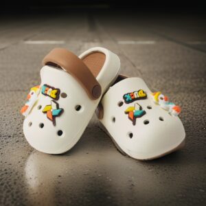 A pair of Duck design crocs Rubber upper pull-on flat Cushioned footbed Patterned rubber outsole